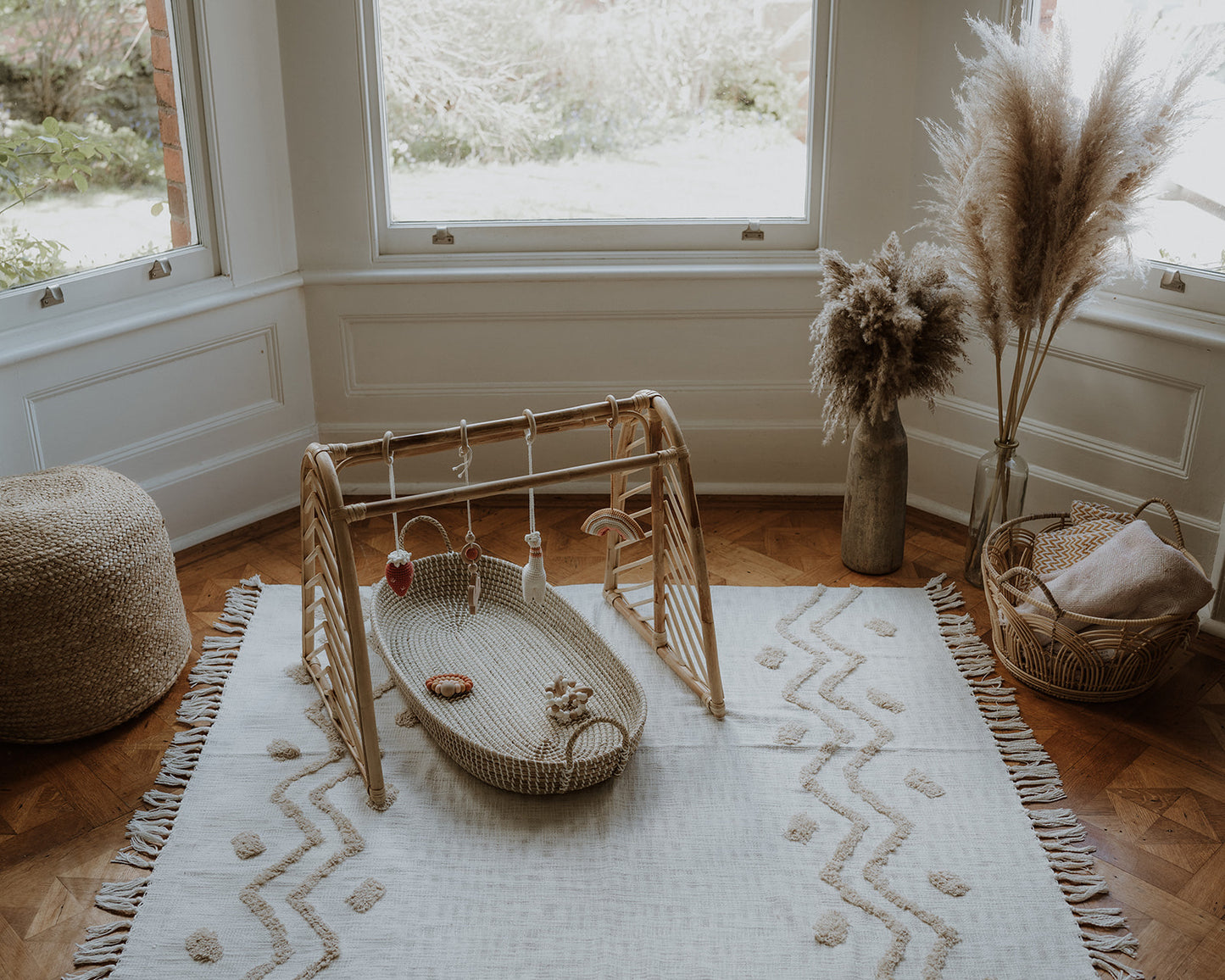 Rattan baby play gym with hanging toys