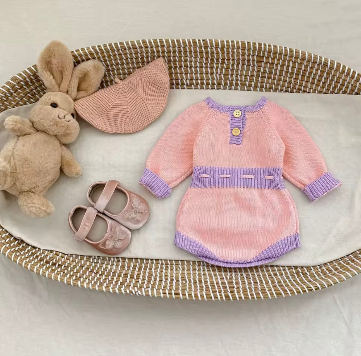 Pink and purple knitted romper