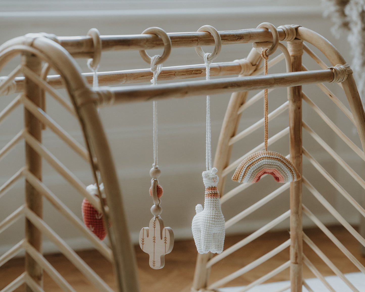 Rattan baby play gym with hanging toys