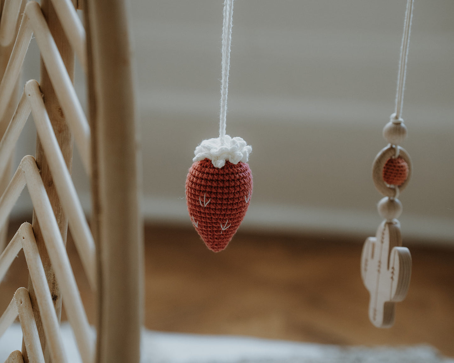 Rattan baby play gym with hanging toys