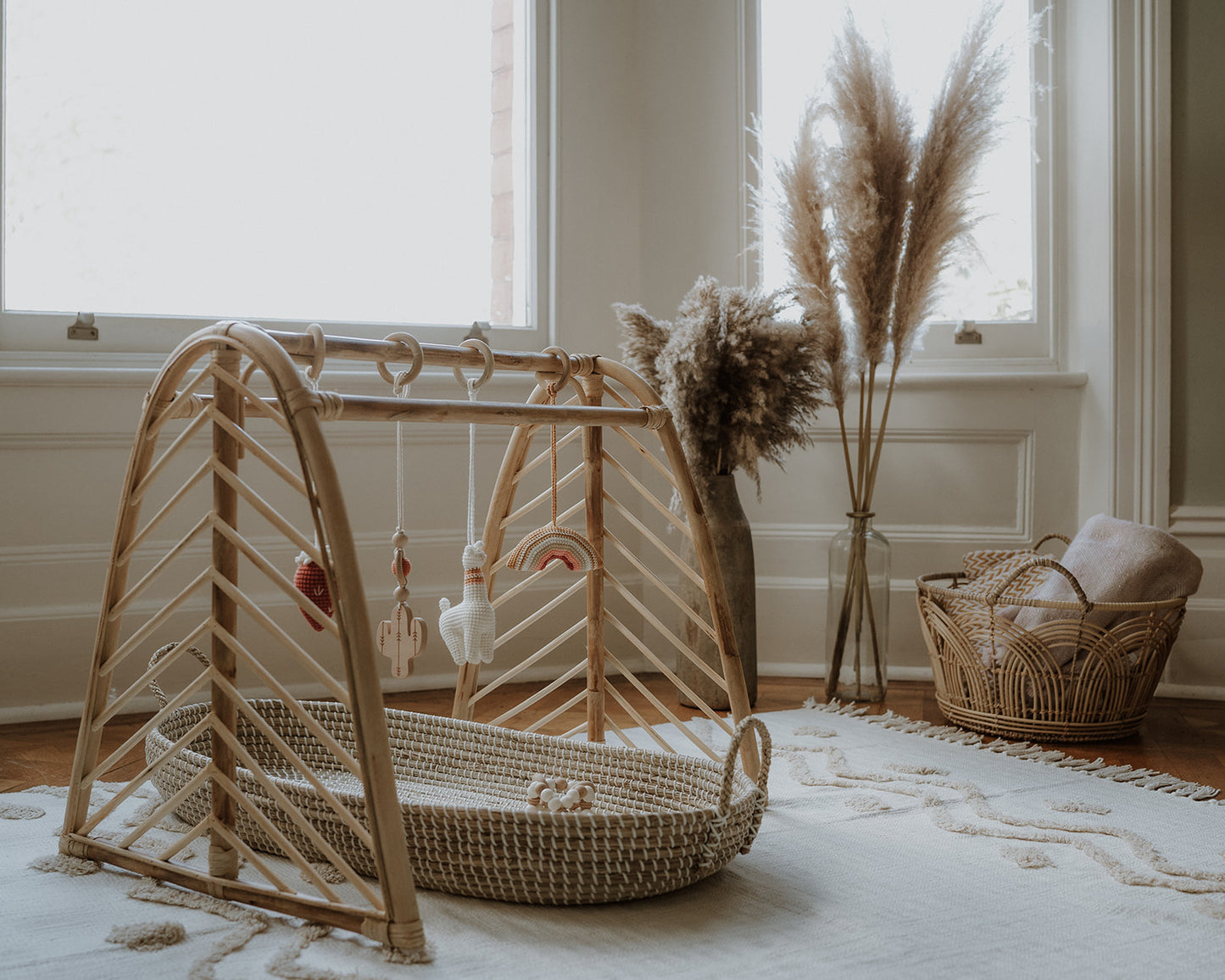 Rattan baby play gym with hanging toys