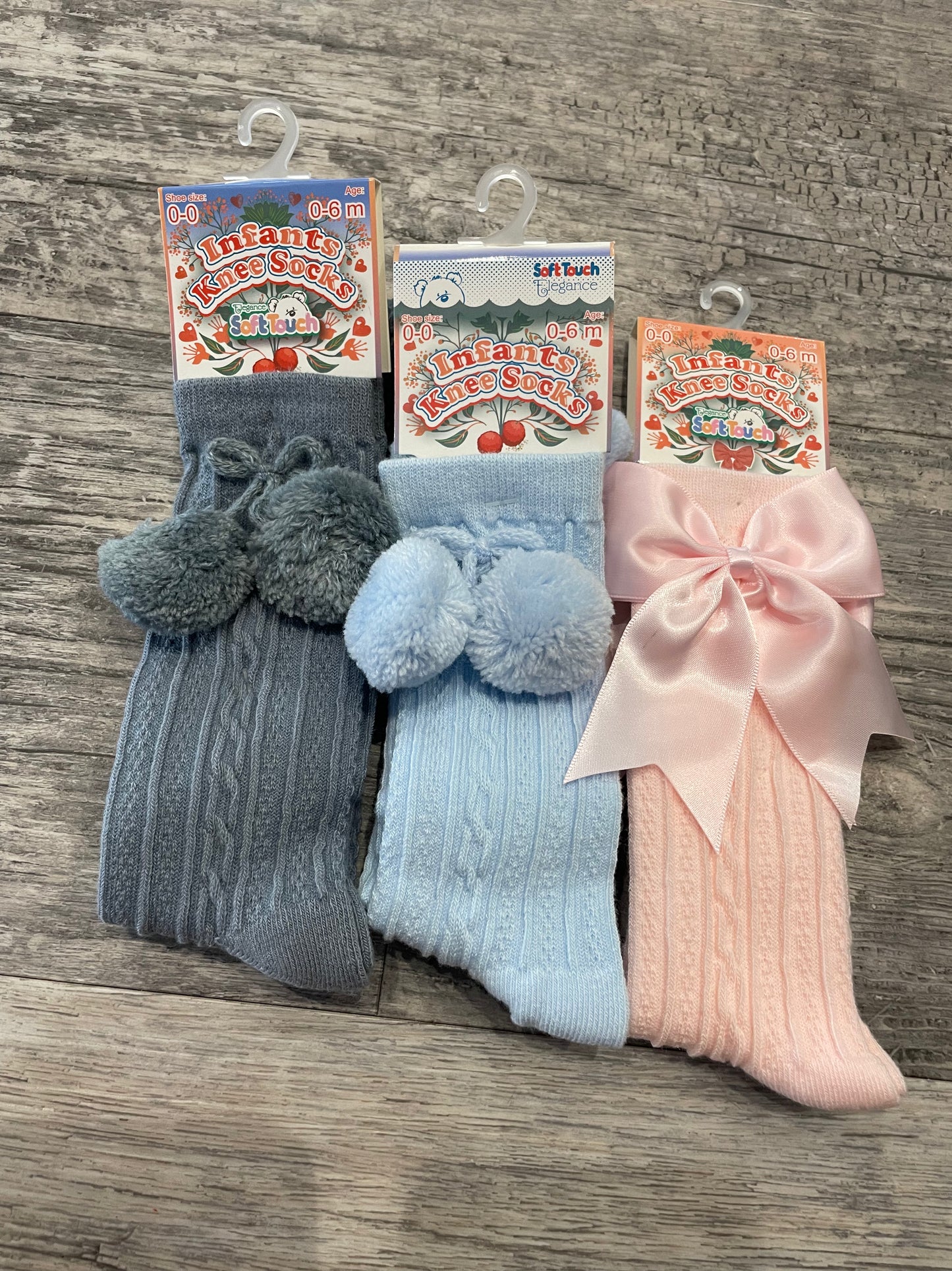 Baby blue knee high pom pom socks