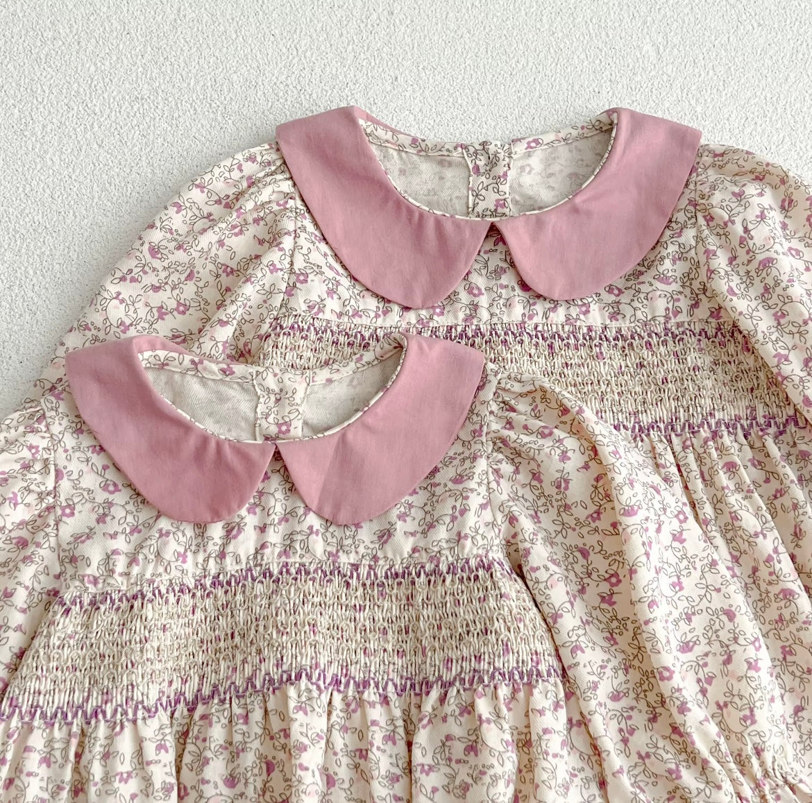 Pink smocked romper
