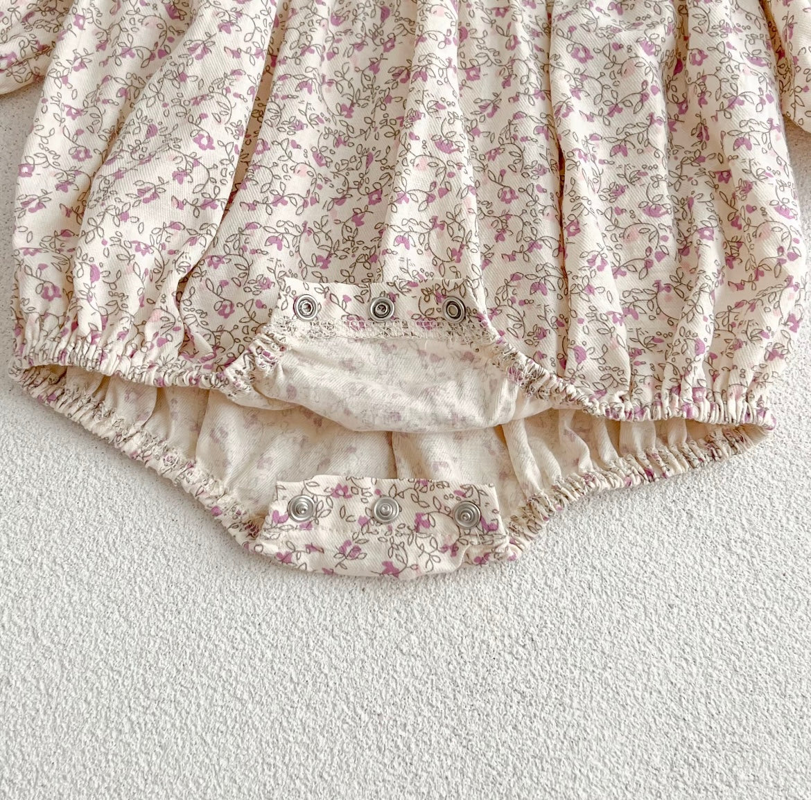 Pink smocked romper