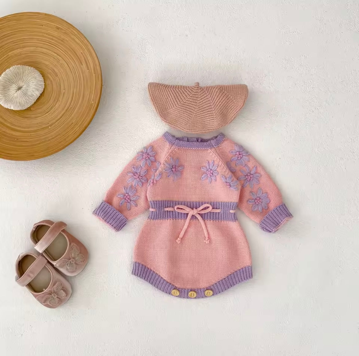 Pink and purple knitted romper