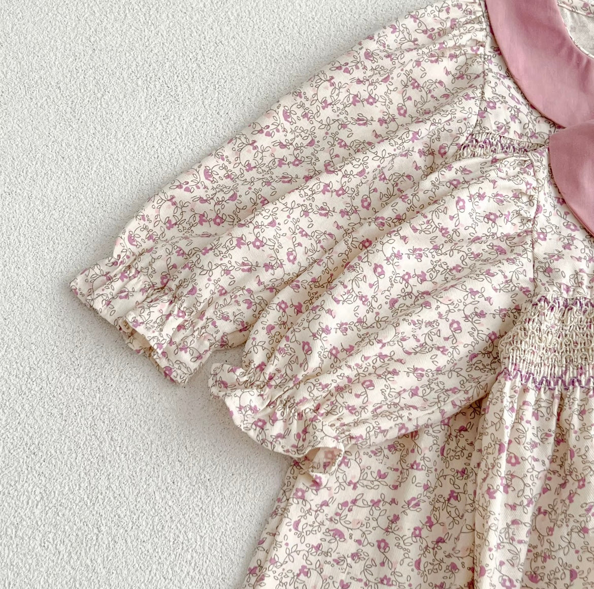 Pink smocked romper