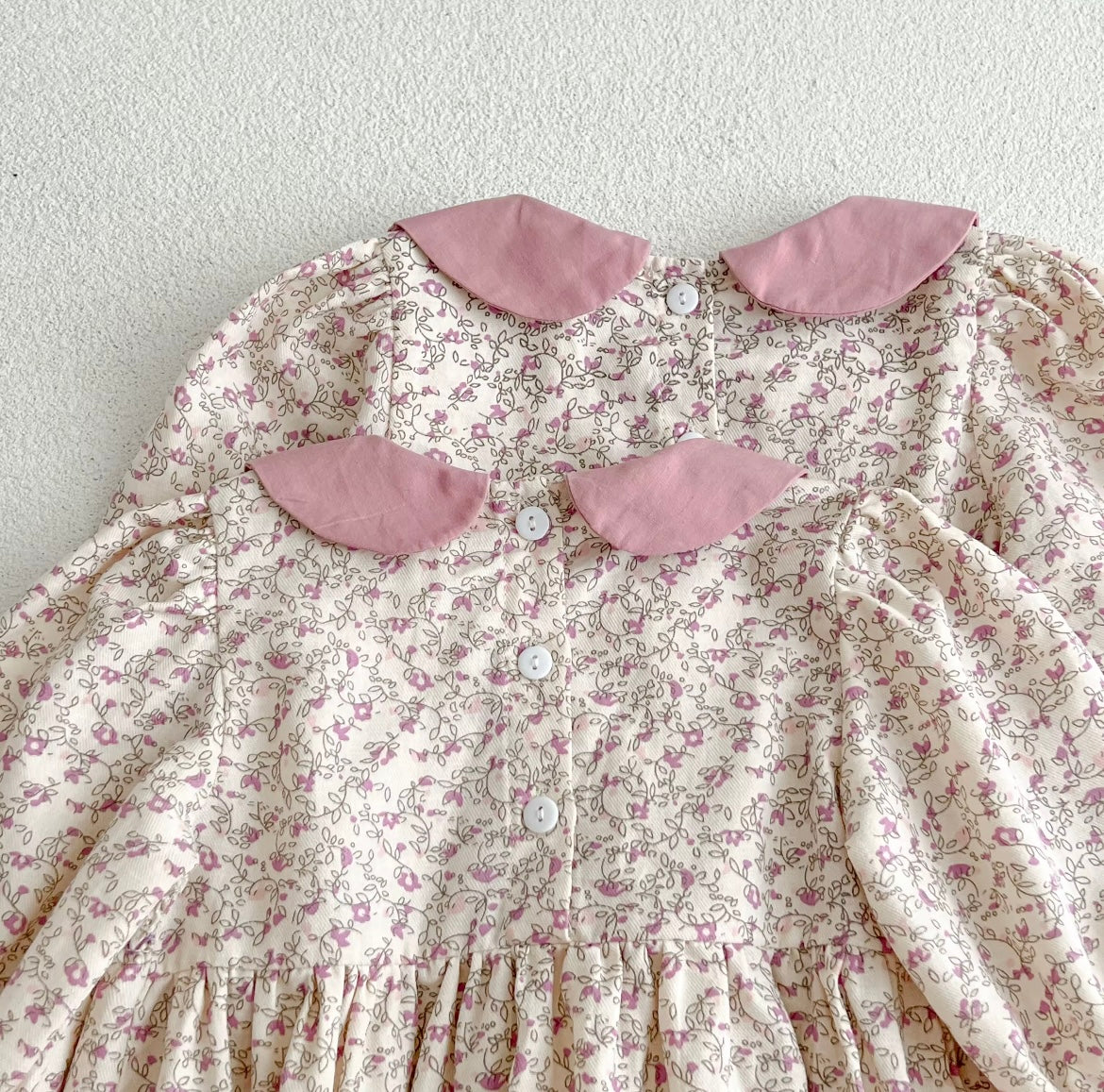 Pink smocked romper