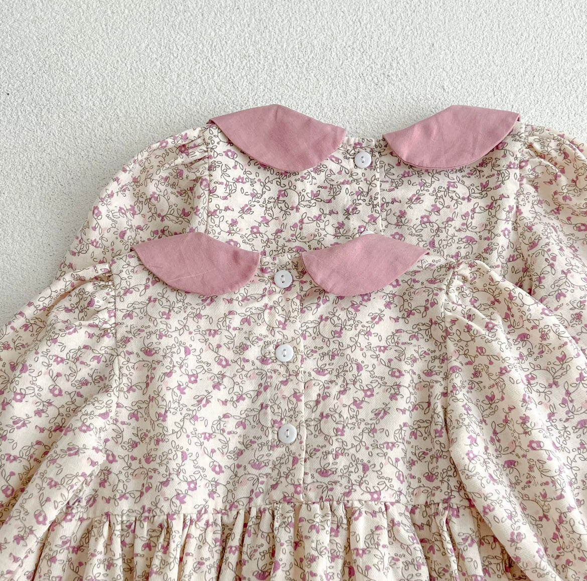 Pink smocked romper