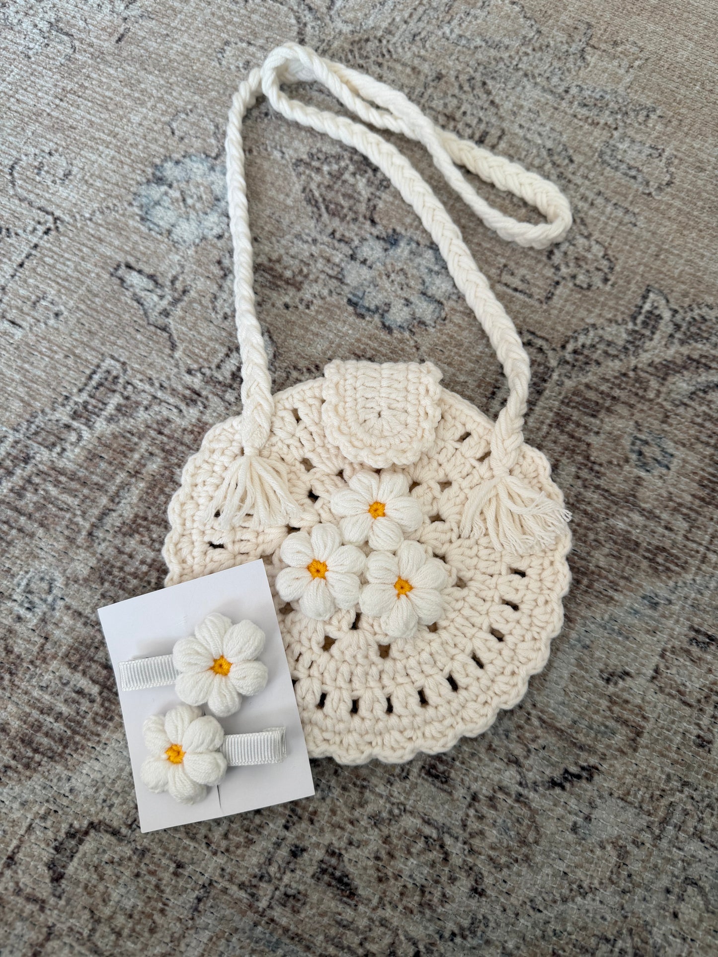 Hand knitted round baby bag and clips set