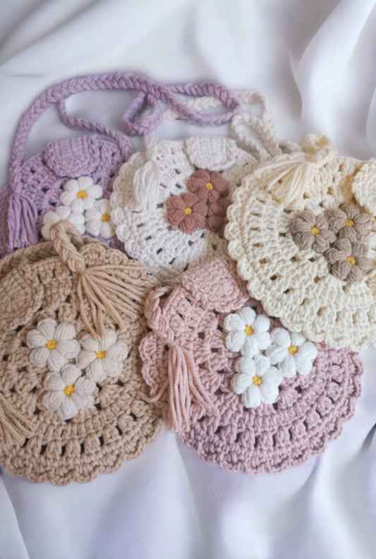 Hand knitted round baby bag and clips set