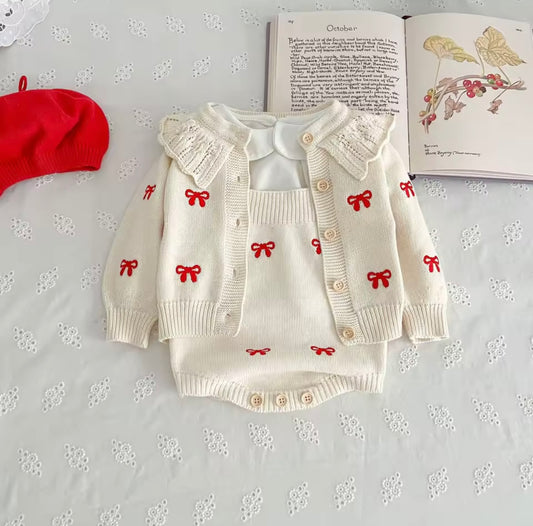 Cream cardigan and romper with red bow detail