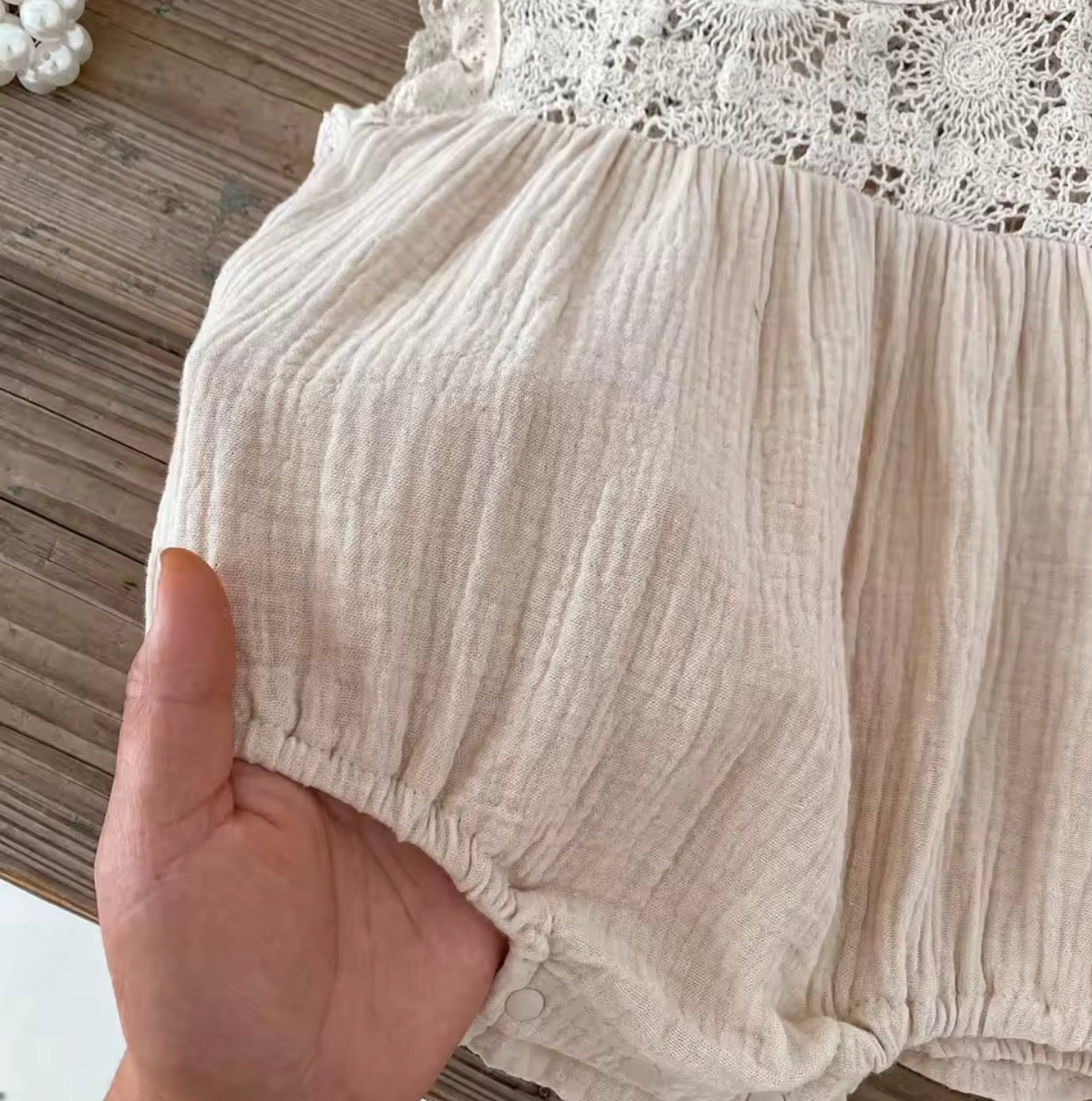Beige crochet baby romper