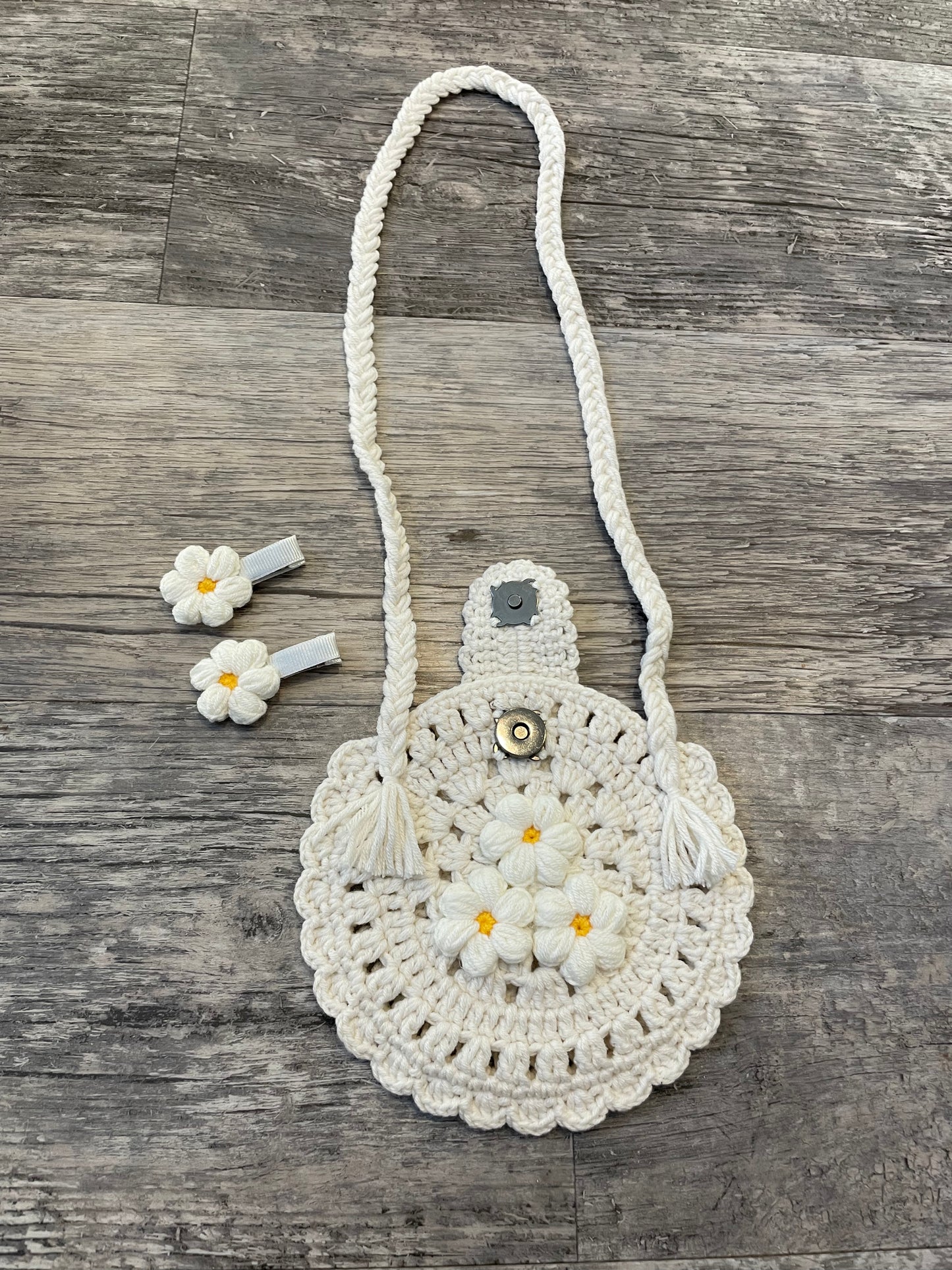 Hand knitted round baby bag and clips set