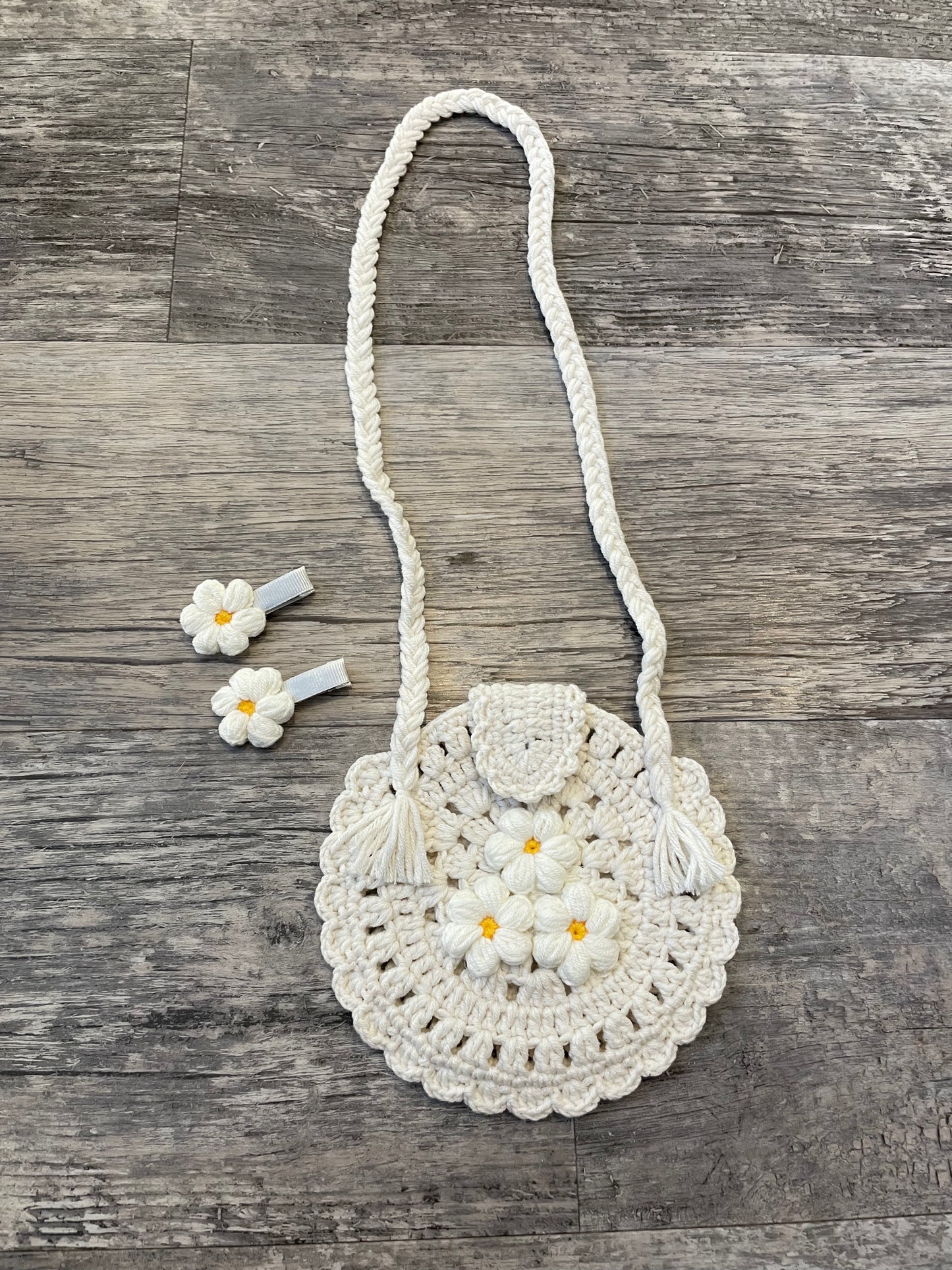 Hand knitted round baby bag and clips set