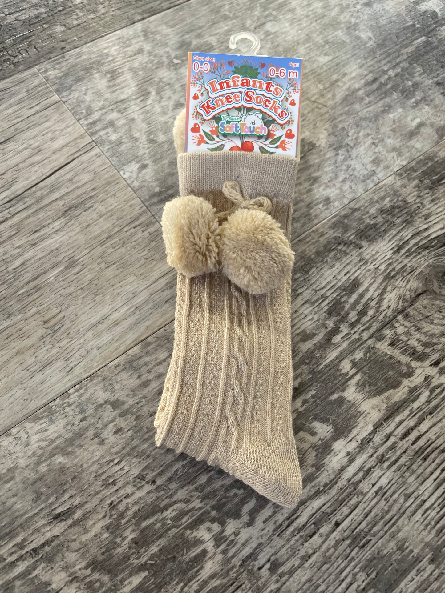 Beige knee high pom pom socks