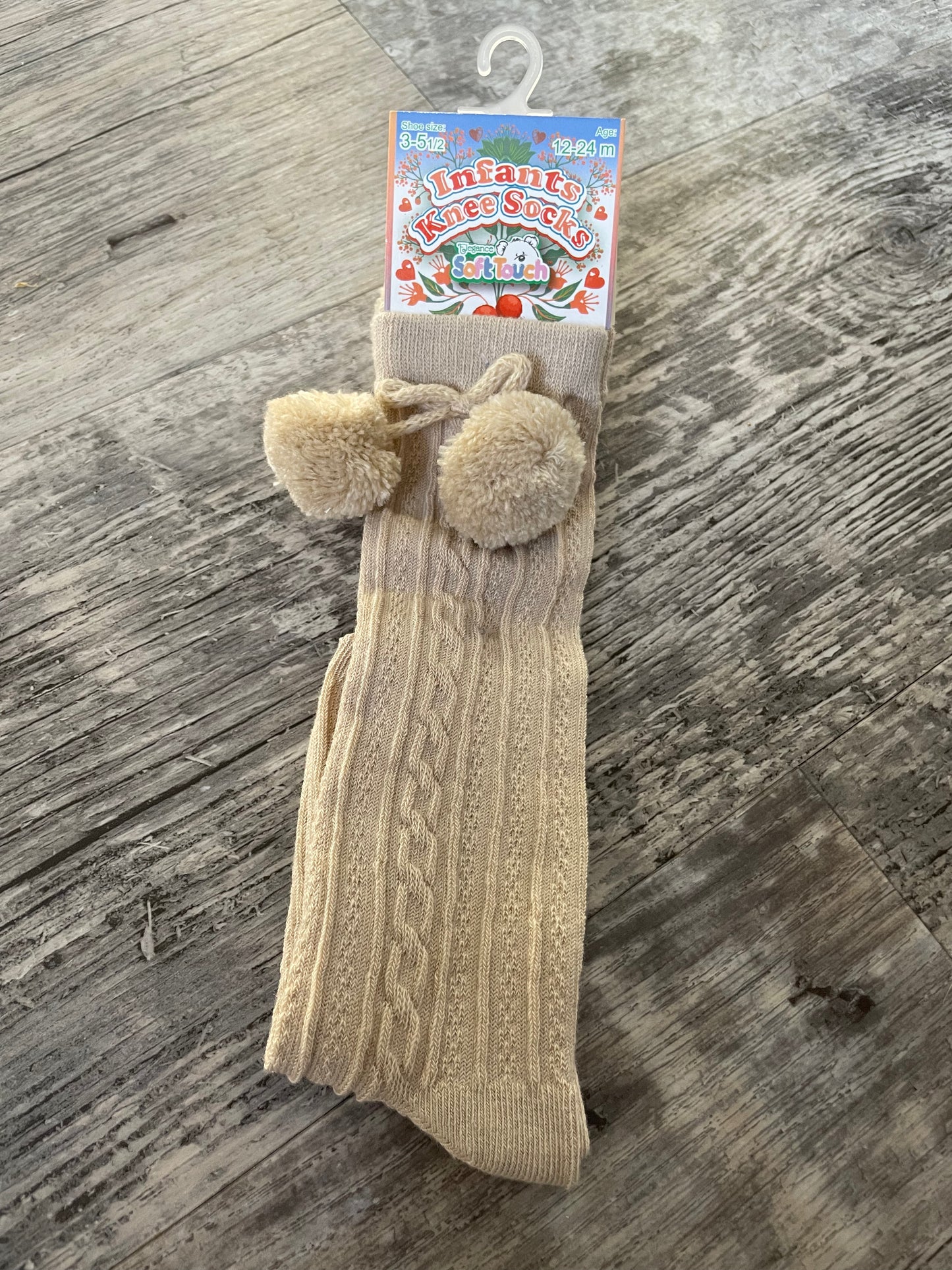 Beige knee high pom pom socks