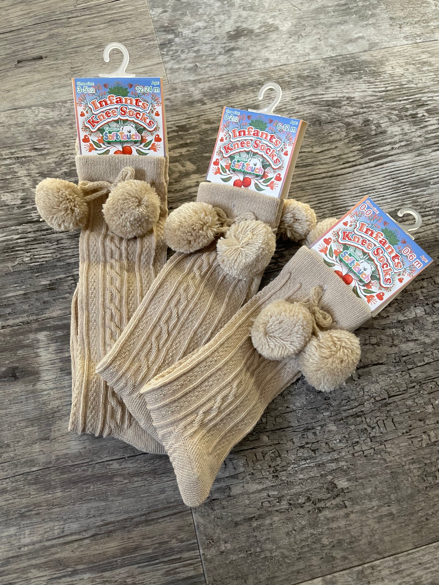Beige knee high pom pom socks