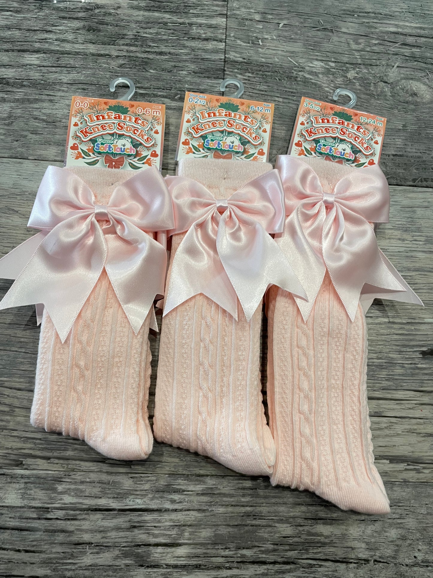 Pink knee high bow socks